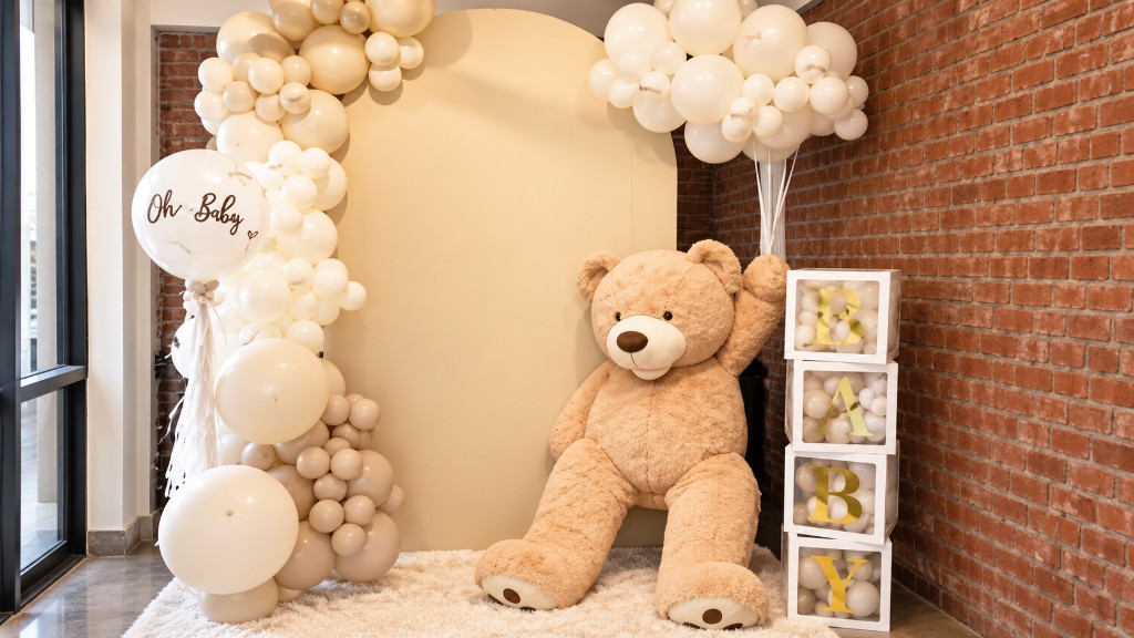 BB Basic balloon backdrop with a cream arch, Oh Baby balloon, teddy bear and stacked BABY boxes.